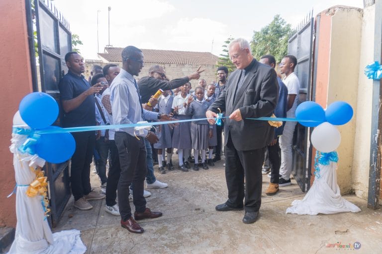 Bishop Matthias Konig cutting the ribbon.